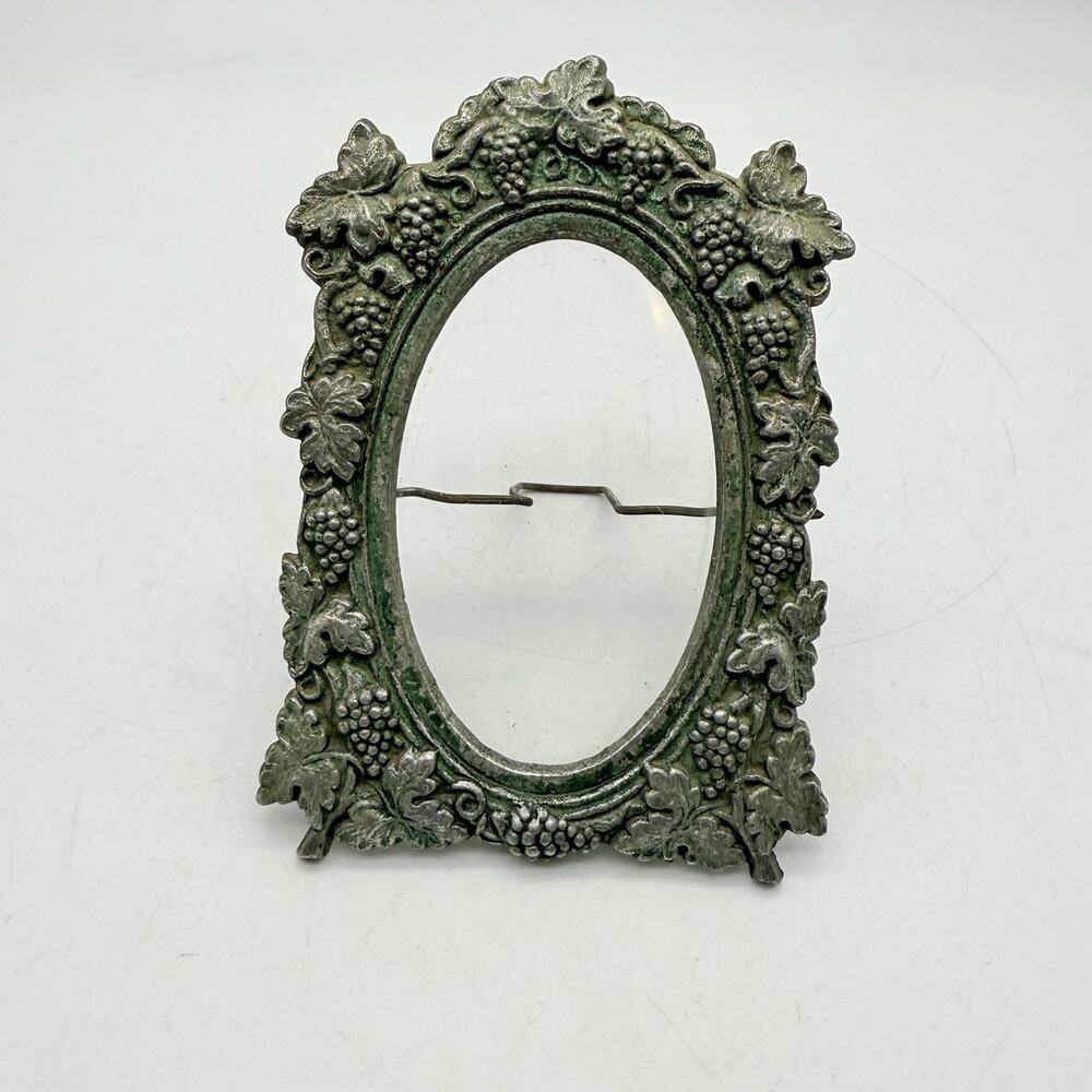 metal oval picture frame with a weathered green finish Vintage